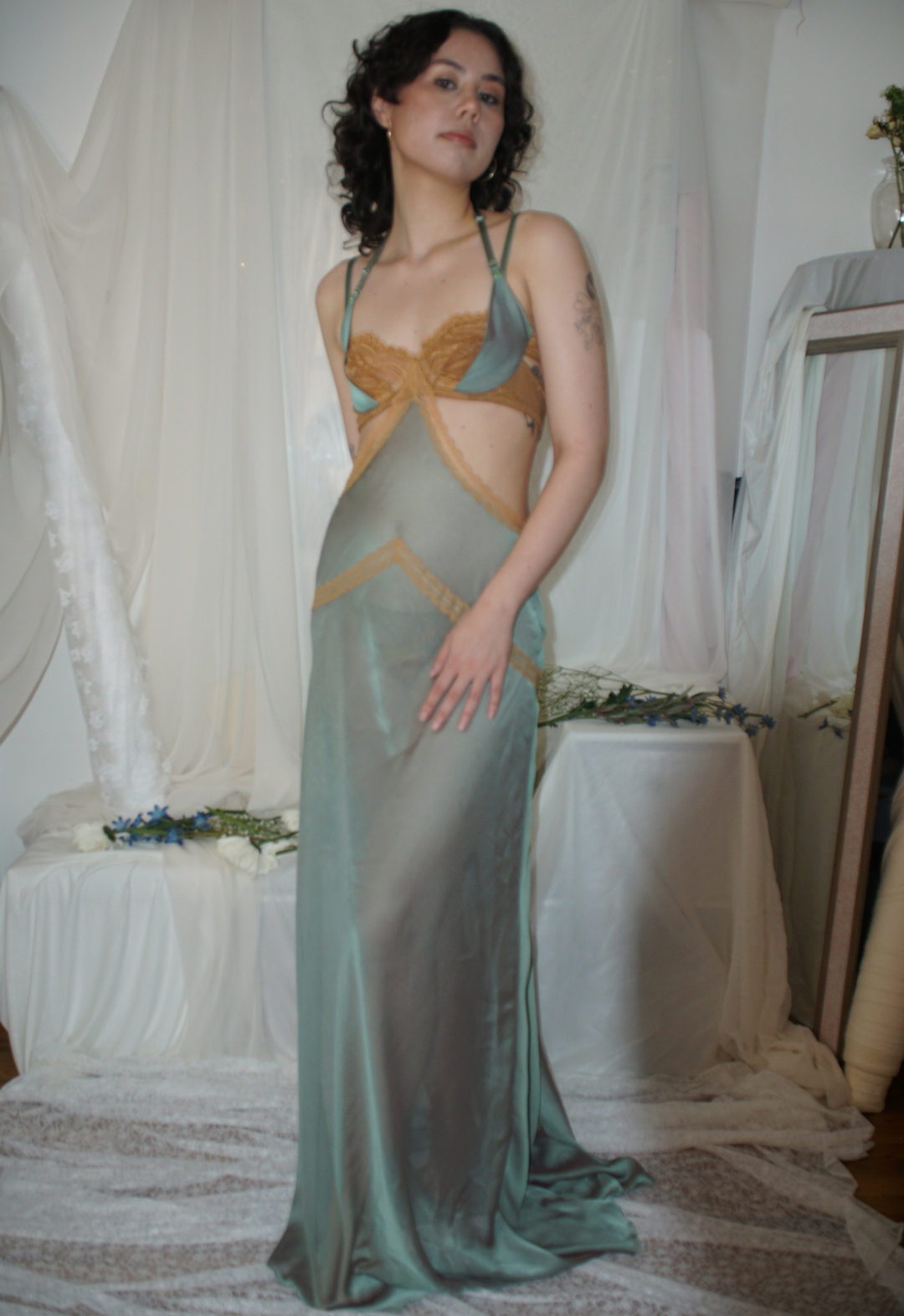 A sheer green chiffon slip down with an underwire bra and sling.
