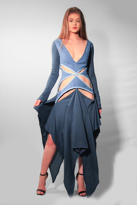 Front facing model wearing blue jersey dress with long sleeves and cutout details.