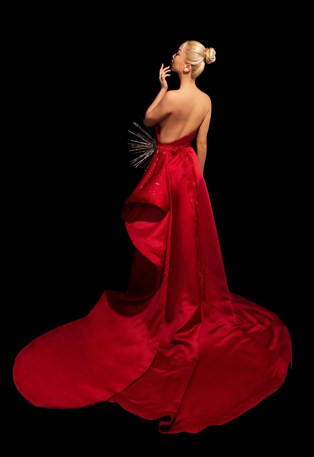 Asymmetrical backless gown with side drape and train