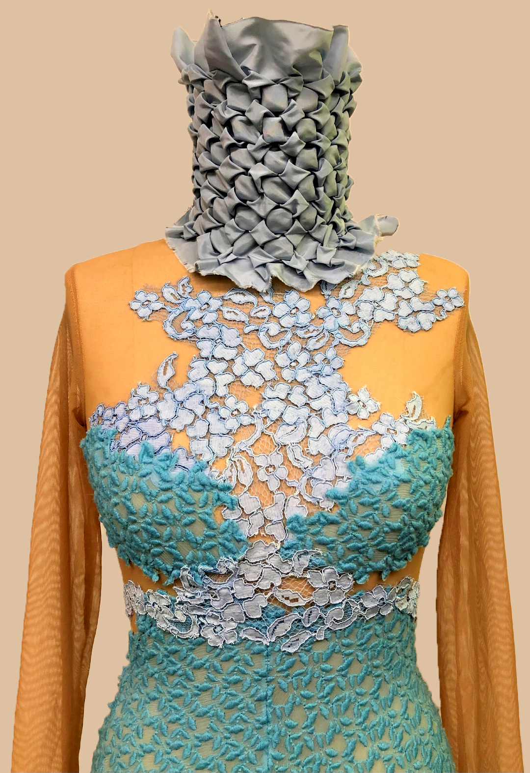 Smocking on neckline and use of multple woven silks as well as a stretch mesh.