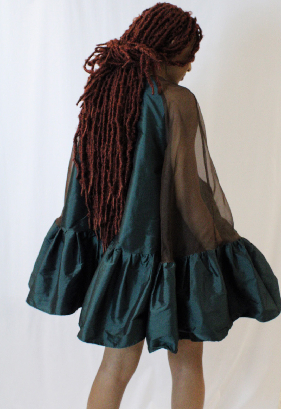 The is a back view of the tent dress showing how wide the sleeves are.