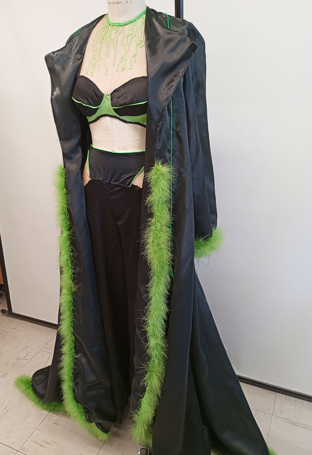 The two-piece set with its matching robe. The robe has green EL wiring glowing, as well as a marabou feather trim around the hem and sleeve cuffs.