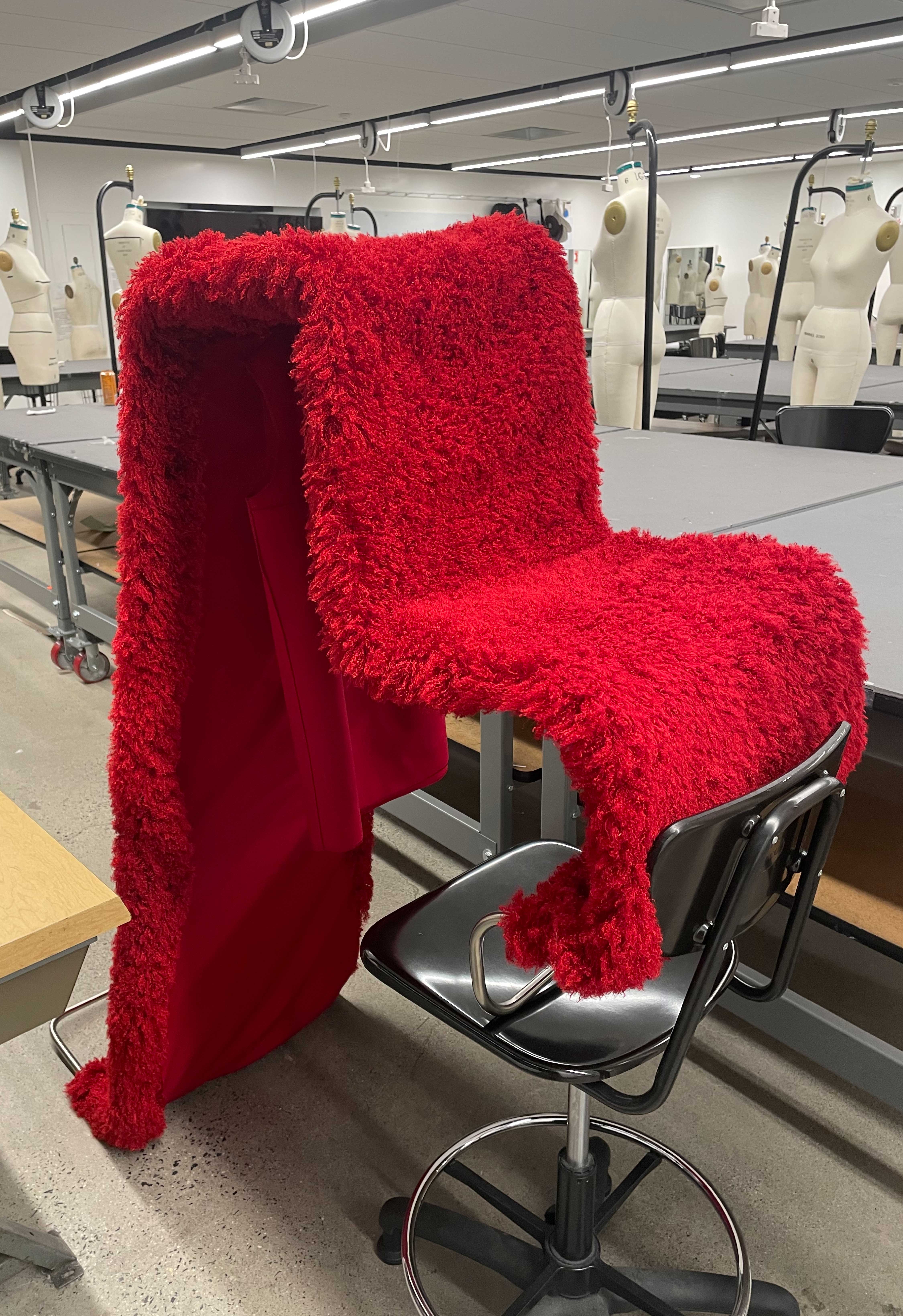 A Work in Progress, the chair dress is leaning on a chair. It's the first prototype of the red chair dress of Image 1.