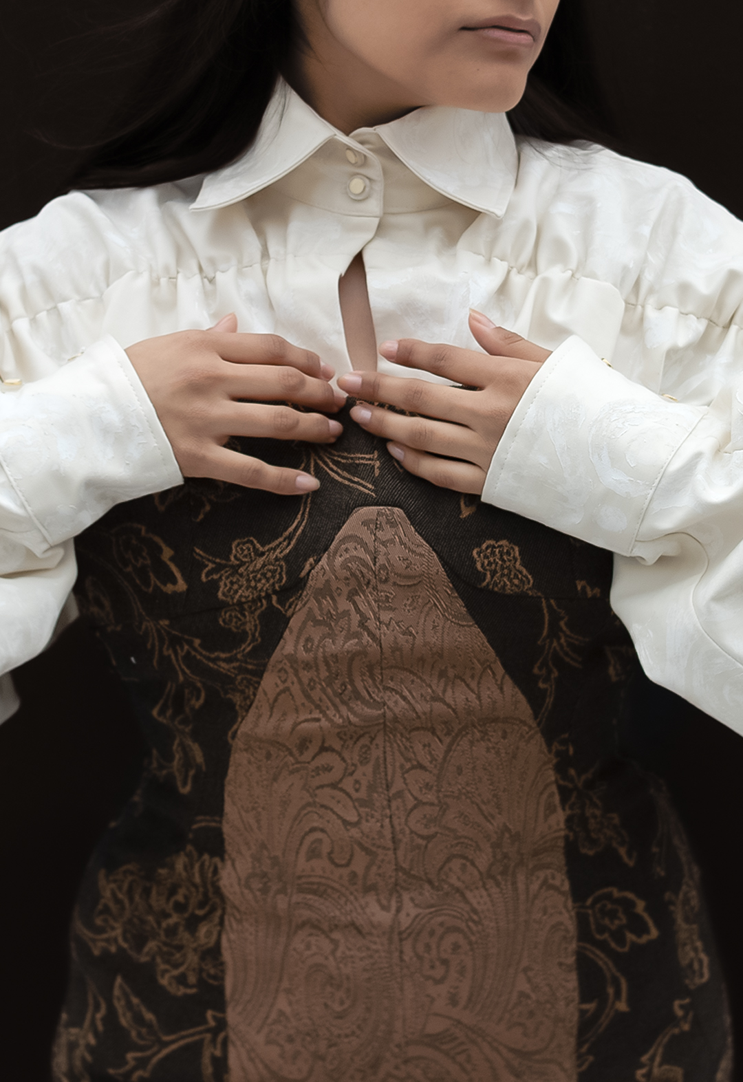 The photo shows a detail view of a ruched collared shirt, which was woodblock carved and printed by hand.