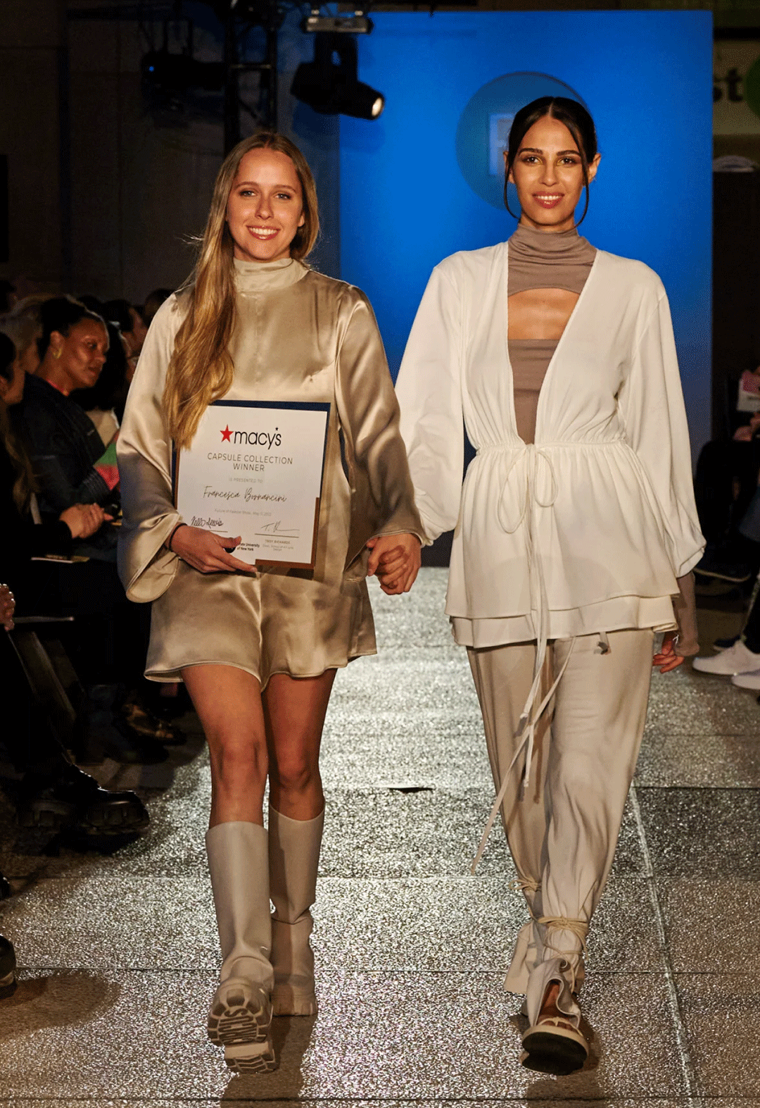 Francesca Bornancini walking down the runway with the model wearing her design