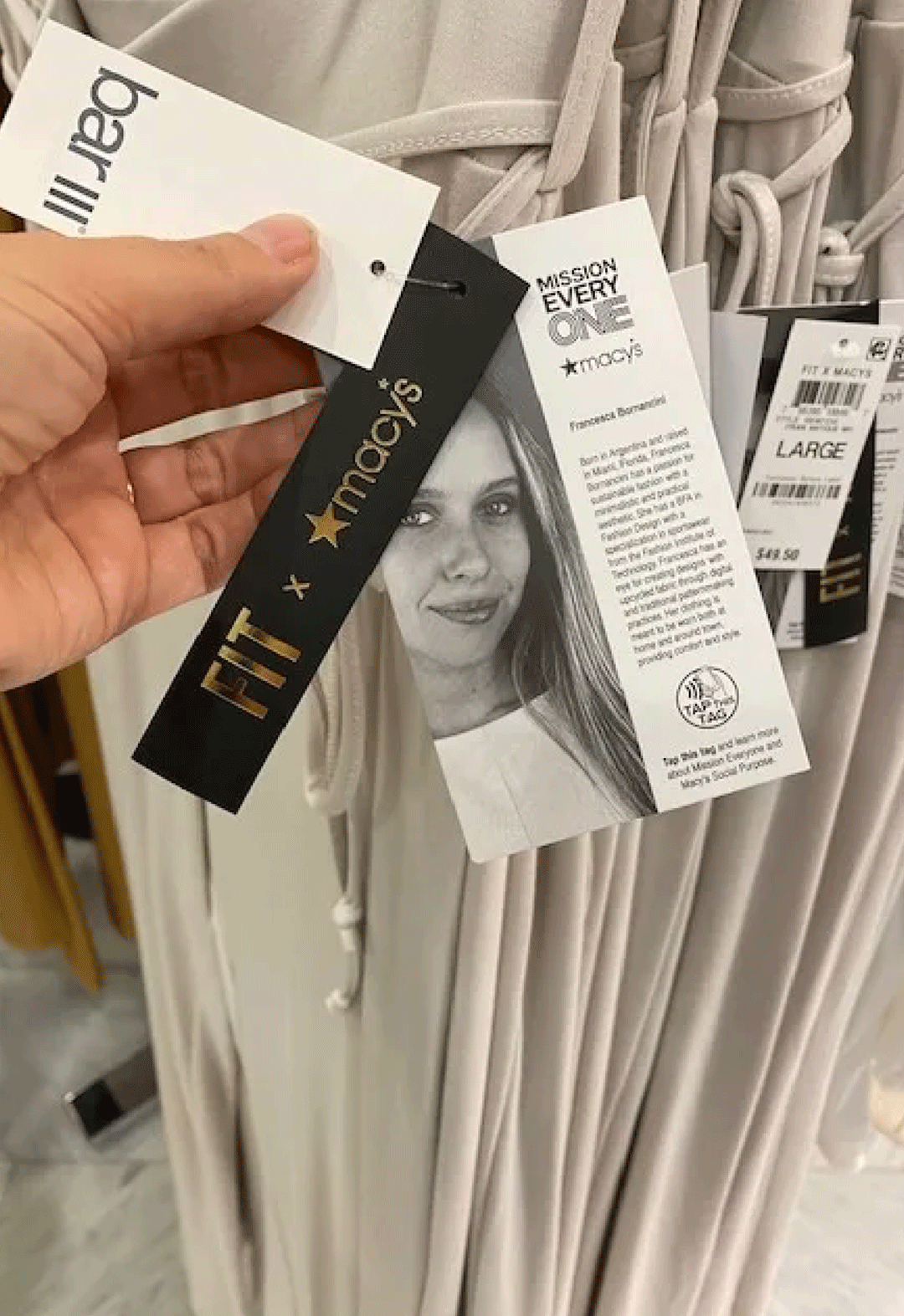 Closeup of clothing tags displaying Macy's and FIT's collaboration 