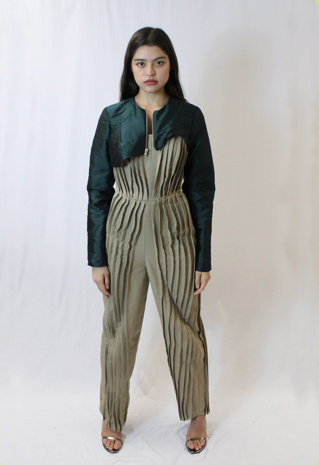 This is a strapless pleated jumpsuit complemented with an asymmetrical bolero jacket.