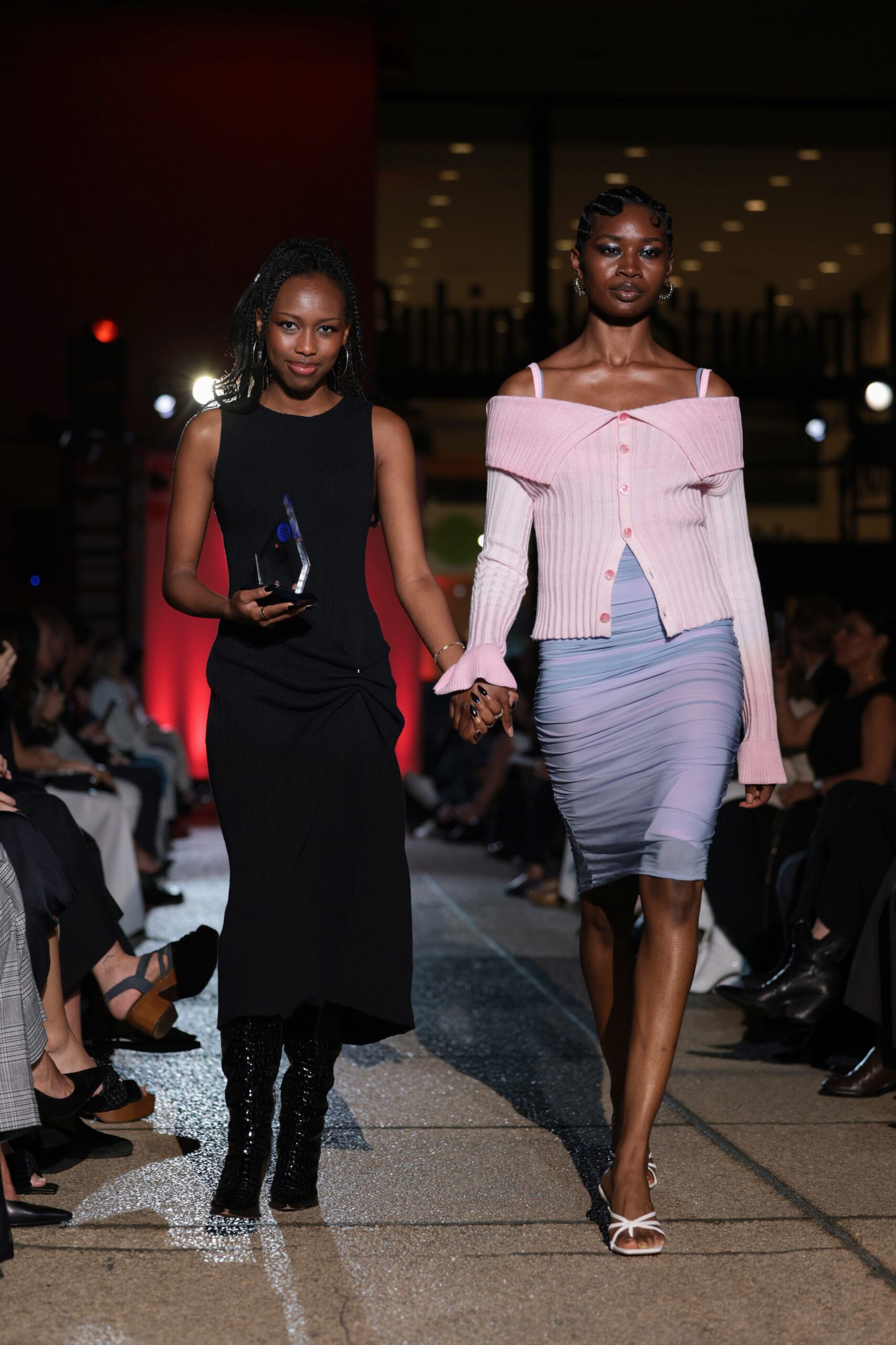 NEW YORK, NEW YORK - MAY 08: A Critic Award Winner and a model at the 2025 Future of Fashion runway show presented by Macy's held at the Fashion Institute of Technology on May 08, 2025 in New York City.
